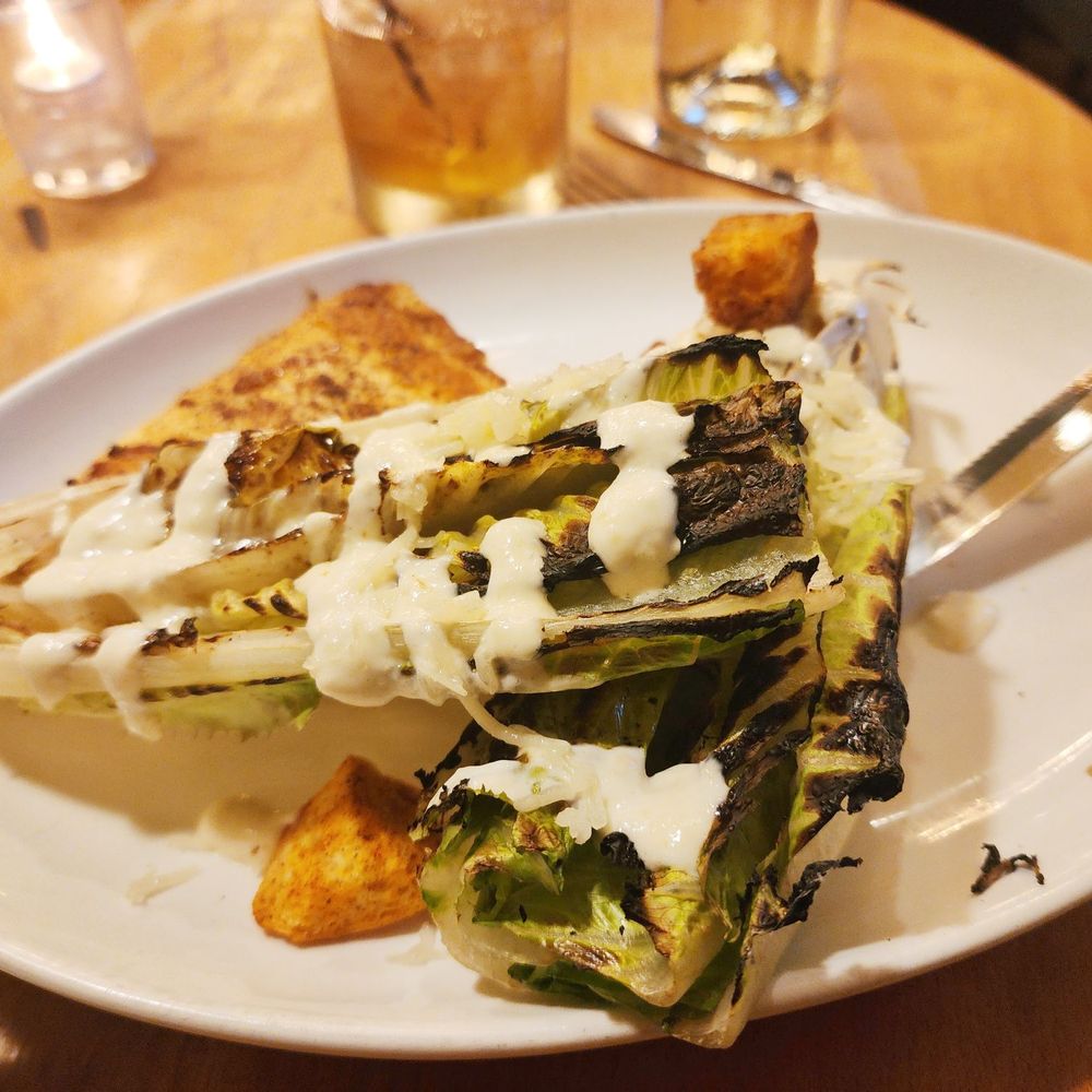 JoJo Wine Bar & Bistro - Grilled romaine with salmon - New American Near Me - Pittsford, New York JoJo Wine Bar & Bistro - Grilled romaine with salmon - New American Near Me - Pittsford, New York