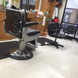 Main Exchange Barber Shop - See the small non-barber chair? That's where they cut your hair