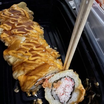 I Love Sushi - a sushi roll with chopsticks - Sushi Bars Near Me - Davis, California