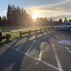 The parking lot overlooks the field.