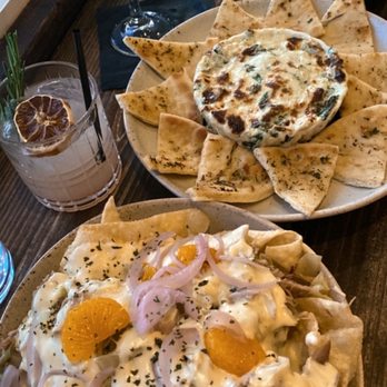Reid's Apothecary - Duck confit nachos on the bottom, spinach dip on top with warm garlic pita - New American Near Me - Brunswick, Georgia