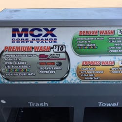 MCX Gas Station - Like prices off-base but you can use their facility to wash the car yourself for $2.50(?) and self vacuum for $1.  4 vacuums avail.