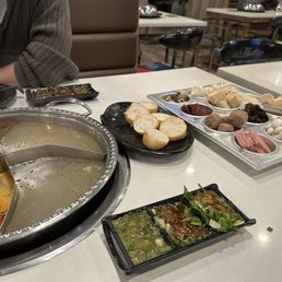 spicy and hot soup with chicken coconut soup and many hot pot ingredients!