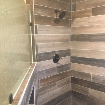 Circle G Construction & Demolition - a shower with wood tile - General Contractors Near Me Circle G Construction & Demolition - a shower with wood tile - General Contractors Near Me