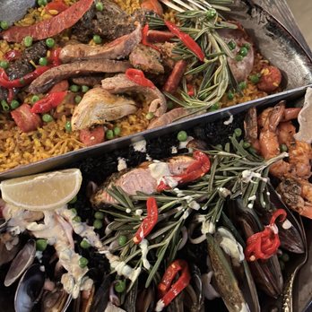 Cafe Sevilla - Meat paella and Black Seafood Paella Familia - Spanish Near Me - Costa Mesa, California