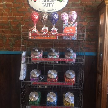 Sugar On Main - a display of candy in front of a brick wall - Candy Stores Near Me - Madison, Indiana