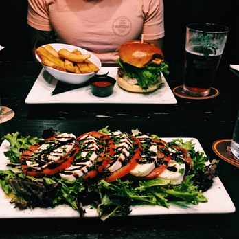 Park Lane Tavern - Caprese Salad up front and Corned Beef Burger in the back. Both delicious! - Fish & Chips Near Me - Hampton, Virginia Park Lane Tavern - Caprese Salad up front and Corned Beef Burger in the back. Both delicious! - Fish & Chips Near Me - Hampton, Virginia