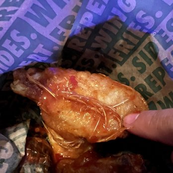Wingstop - Mango habanero bone in wing with its feathers still attached. - Chicken Wings Near Me - Vacaville, California Wingstop - Mango habanero bone in wing with its feathers still attached. - Chicken Wings Near Me - Vacaville, California