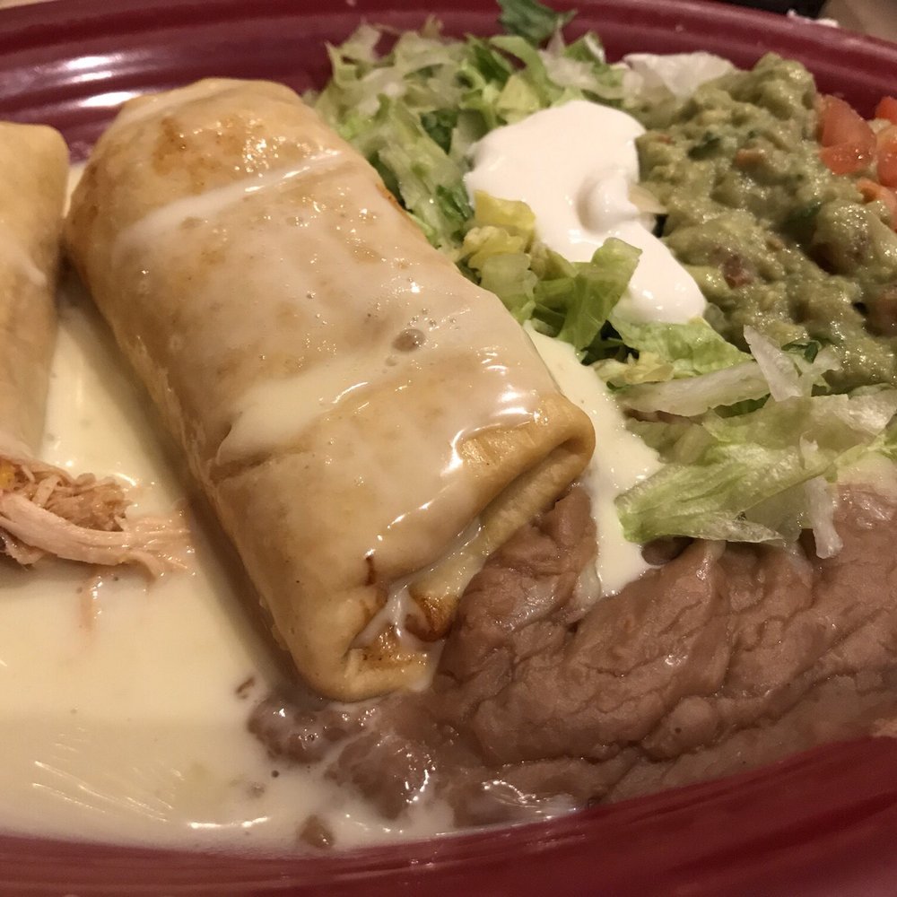 El Jinete - Chimichanga house combination $11.50 with beans, quac, lettuce, tomato, sour cream. - Mexican Near Me - Fairfax, Ohio El Jinete - Chimichanga house combination $11.50 with beans, quac, lettuce, tomato, sour cream. - Mexican Near Me - Fairfax, Ohio