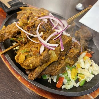 Biryani Pot - a plate of food on a table - Indian Near Me - Mobile, Alabama