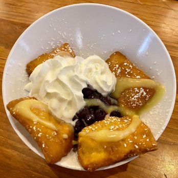 Ruby Slipper Central Business District - New Orleans style beignets with almond cheesecake and blueberry compote topped with lemon curd, whipped cream, and powdered sugar - Breakfast & Brunch Near Me - New Orleans, Louisiana Ruby Slipper Central Business District - New Orleans style beignets with almond cheesecake and blueberry compote topped with lemon curd, whipped cream, and powdered sugar - Breakfast & Brunch Near Me - New Orleans, Louisiana
