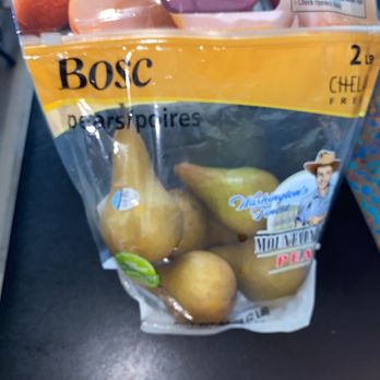 Lidl - Bosc Pears!! Yummy Came 6 in a bag... very reasonably priced - A 2-pound bag of Bosc pears from Lidl is placed on a store shelf. The packaging is transparent, showing several yellowish-brown pears inside. The bag features branding and product information, including the name 'Bosc' and a graphic of a farmer. The pears are arranged inside the bag, and part of the packaging design includes a yellow and black color scheme. The image captures the pears and packaging clearly, with some reflections on the plastic. - Grocery Near Me - Lanham, Maryland
