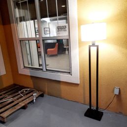 Outside front entry: Floor lamp and wood pallet Outside front entry: Floor lamp and wood pallet