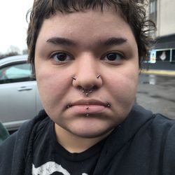East Coast Ink - The lower side(left) is the side he re-pierced. A photo of me right outside the shop in the parking lot.