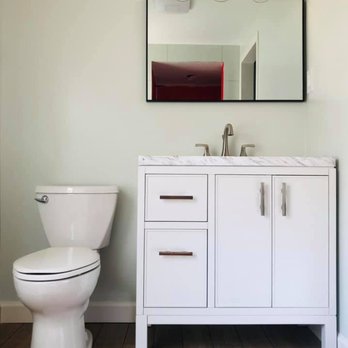 Van Sickle Construction - a bathroom with a toilet and vanity - General Contractors Near Me Van Sickle Construction - a bathroom with a toilet and vanity - General Contractors Near Me