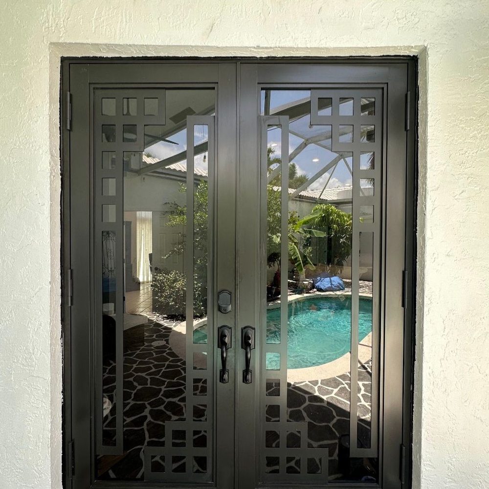 Boca Impact Window and Door - New bronze hurricane proof front door - Windows Installation Near Me - Boca Raton, Florida Boca Impact Window and Door - New bronze hurricane proof front door - Windows Installation Near Me - Boca Raton, Florida