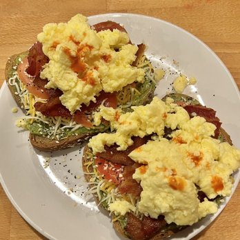 Bridge Street Brew - Avocado Toast on multigrain with tomatoes, eggs, bacon and shredded cheddar cheese - Coffee & Tea Near Me - Chippewa Falls, Wisconsin Bridge Street Brew - Avocado Toast on multigrain with tomatoes, eggs, bacon and shredded cheddar cheese - Coffee & Tea Near Me - Chippewa Falls, Wisconsin