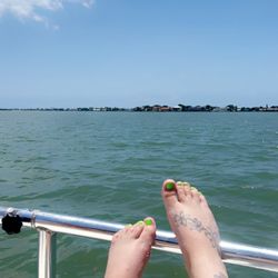 Clearwater Jetski and Funboat Adventures - Feet on the front of tiki