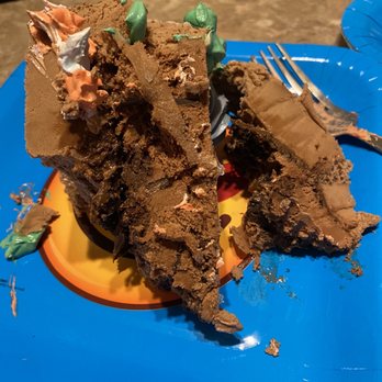 DQ / Orange Julius - a piece of chocolate cake on a blue plate - Ice Cream & Frozen Yogurt Near Me - Peoria, Arizona