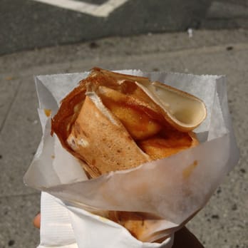 Chouchou Breton Crepes - a hand holding a sandwich - French Near Me Chouchou Breton Crepes - a hand holding a sandwich - French Near Me