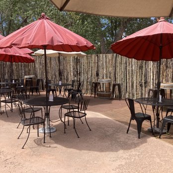 Blue Heron Brewing Company - Blue Heron Brewing Company.  Rear, outdoor umbrella seating. - Breweries Near Me - Embudo, New Mexico