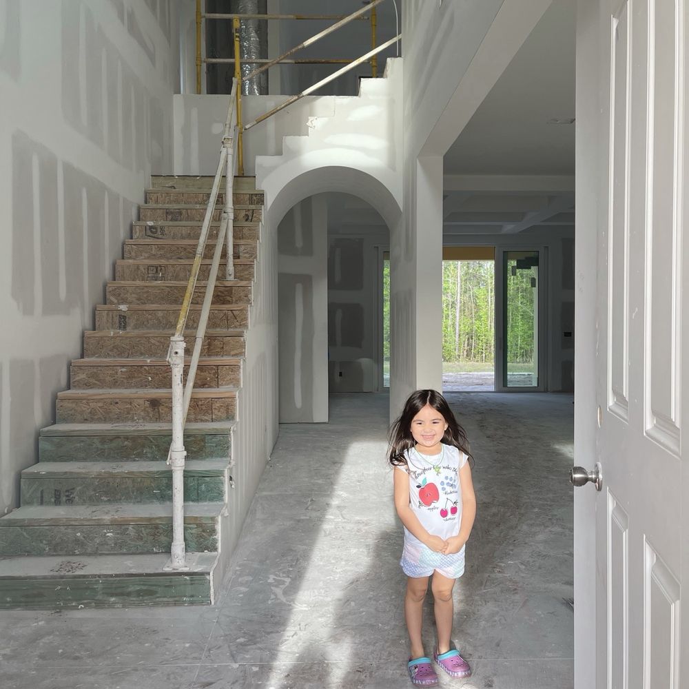 CornerStone Homes - Baby girl at the front door (unfinished) - General Contractors Near Me - Jacksonville, Florida CornerStone Homes - Baby girl at the front door (unfinished) - General Contractors Near Me - Jacksonville, Florida