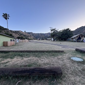 Camp Catalina Whites Landing - view towards the various huts- mountains in the background with hiking trails. ocean is behind me. - Campgrounds Near Me - Avalon, California Camp Catalina Whites Landing - view towards the various huts- mountains in the background with hiking trails. ocean is behind me. - Campgrounds Near Me - Avalon, California