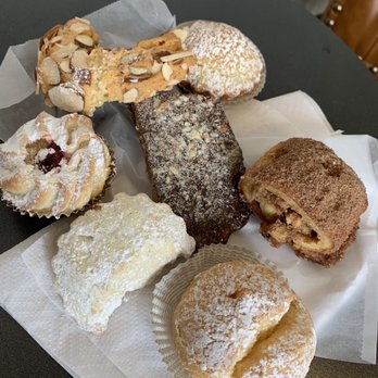 Villa Italia - Almond Cookie, Pasticiotti tart, Cinnamon Walnut Pastry, Cream Puff, Lemon Cookie, Almond Cherry Tart. Center: Chocolate Almond Brittle - Bakeries Near Me - Schenectady, New York