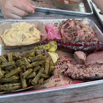 Wright's Barbecue - Three meat/two side meal - Brisket, original sausage, pork with mashed potatoes and green beans. - Barbeque Near Me - Bentonville, Arkansas Wright's Barbecue - Three meat/two side meal - Brisket, original sausage, pork with mashed potatoes and green beans. - Barbeque Near Me - Bentonville, Arkansas