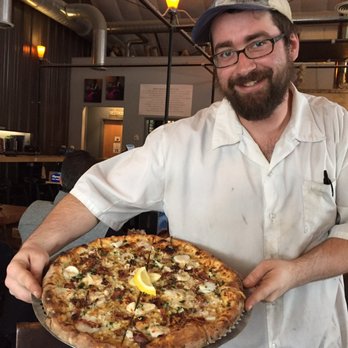 Folino's Pizza - Check out this awesome white pizza with its chef - scallops, bacon, garlic, parsley, three cheeses and lemon zest! Buon Appetito! - Pizza Near Me - Shelburne, Vermont