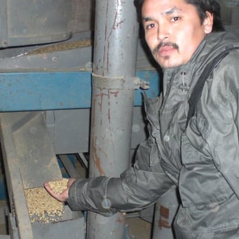 Bolivia's Fruit USA - Alex checking our coffee at the pre sorting site in El Alto, Bolivia - Coffee & Tea Near Me Bolivia's Fruit USA - Alex checking our coffee at the pre sorting site in El Alto, Bolivia - Coffee & Tea Near Me