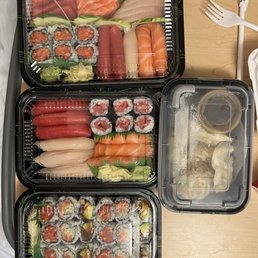 a tray of sushi and vegetables a tray of sushi and vegetables