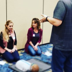 Aplomb Medical Training Center - Students preparing to practice child CPR.