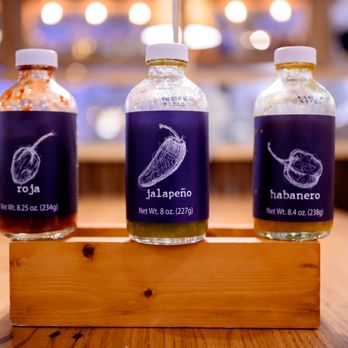 bartaco - Reston - three bottles of hot sauce - Tacos Near Me - Reston, Virginia bartaco - Reston - three bottles of hot sauce - Tacos Near Me - Reston, Virginia