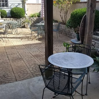 Manny's Universal Cafe - a patio with tables and chairs - Juice Bars & Smoothies Near Me - Greensboro, North Carolina