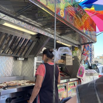 Jesus Hot Dogs - a man standing in front of a hot dog stand - Food Trucks Near Me - Los Angeles, California