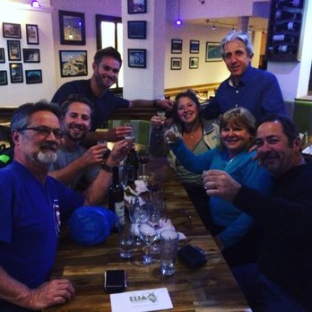 Elia - Enjoying a Greek shot with George, the owner. Yamas! - Greek Near Me - Glasgow, GLG