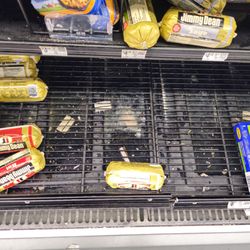 Walmart Supercenter - This is the meat department. Underneath the grating is a mess. This is a health hazard and needs to be corrected asap.