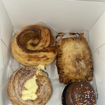 Sweet Rustic Bake Shop - Morning Bun, Vanilla Bean Cruffin, Strawberry Pop-Tart, Blueberry Cheesecake Pop-Tart and a Chocolate Cupcake! - Desserts Near Me Sweet Rustic Bake Shop - Morning Bun, Vanilla Bean Cruffin, Strawberry Pop-Tart, Blueberry Cheesecake Pop-Tart and a Chocolate Cupcake! - Desserts Near Me