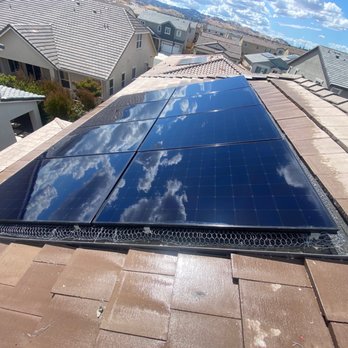 Edward’s Roofing - Shiny solar panels with wiring all around - Gutter Services Near Me - Bay Point, California