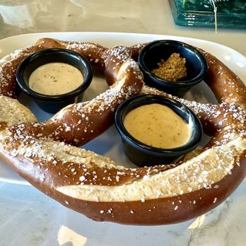 Proper Restaurant & Bar - GIANT PRETZEL-dusted with salt and served with Idyll Hounds-infused beer cheese and other dipping sauces - Beer Bar Near Me - Inlet Beach, Florida Proper Restaurant & Bar - GIANT PRETZEL-dusted with salt and served with Idyll Hounds-infused beer cheese and other dipping sauces - Beer Bar Near Me - Inlet Beach, Florida