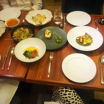 Indian Accent - From left to right: Soft-Shell Crab black dairy dal poha chicken  kofta on bottom, paper roast dosa on top salmon arbi naan - Indian Near Me - New York, New York