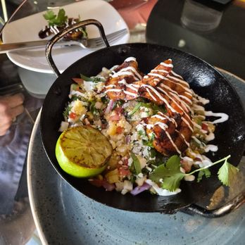 insideOUT - MEZCAL BAJA PRAWNS  MEZCAL BAJA PRAWNS bay jumbo prawns, corn & pineapple salsa, mezcal, lime crema, cotija cheese - Lounges Near Me - San Diego, California