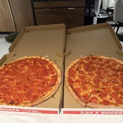 Sal's Pizza - Left: extra pepperoni Right: regular pepperoni
