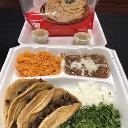Steak tacos, rice and beans.