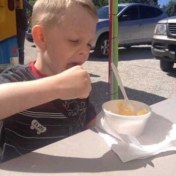 Pineapple Whip - a young boy eating a bowl of food - Desserts Near Me - Robbinsville, North Carolina Pineapple Whip - a young boy eating a bowl of food - Desserts Near Me - Robbinsville, North Carolina