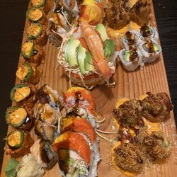 Kiku Sushi Family - The spread of the 6 different rolls we shared!! We left VERY full and satisfied!!!