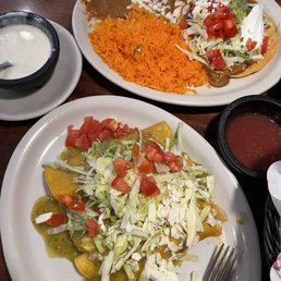 Tostaguac with beans and rice and a side of cheese dip with enchiladas verdé Tostaguac with beans and rice and a side of cheese dip with enchiladas verdé
