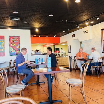Newk's Eatery - Seating area, kitchen, bathroom past the guy in the orange shirt - Pizza Near Me - Huntsville, Alabama Newk's Eatery - Seating area, kitchen, bathroom past the guy in the orange shirt - Pizza Near Me - Huntsville, Alabama