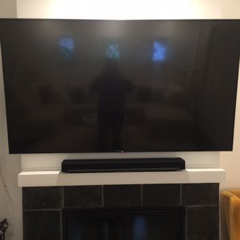 Modtech Design - Nice install Juan helped me with, 75" 4K TV on a full motion bracket over my fireplace w/ sound bar. - Home Theatre Installation Near Me Modtech Design - Nice install Juan helped me with, 75" 4K TV on a full motion bracket over my fireplace w/ sound bar. - Home Theatre Installation Near Me